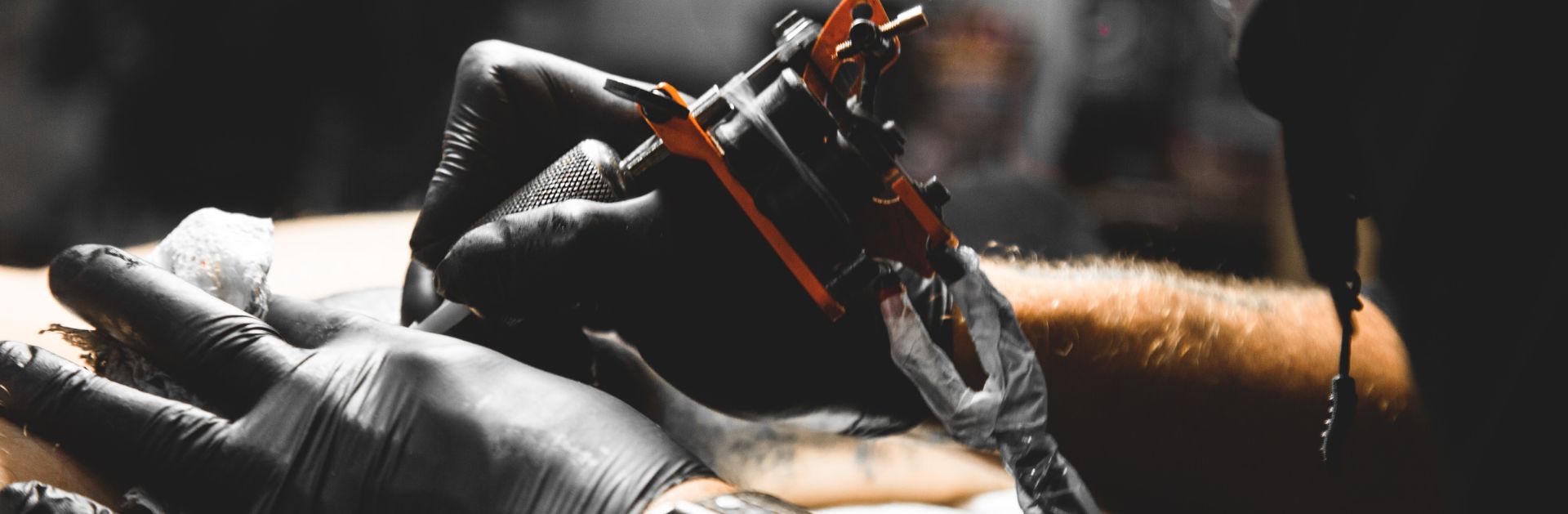 Close up image of a tattoo being inscribed on an a person.